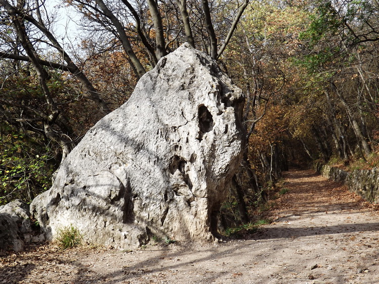 The headless Lion Rock stands beside the gravel promenade