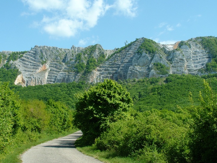 The panorama of Bél-kő Mountain taken from the asphalt road
