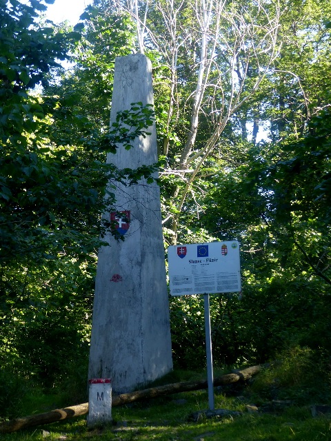 Concrete memorial column stands on the peak of Nagy-Milic